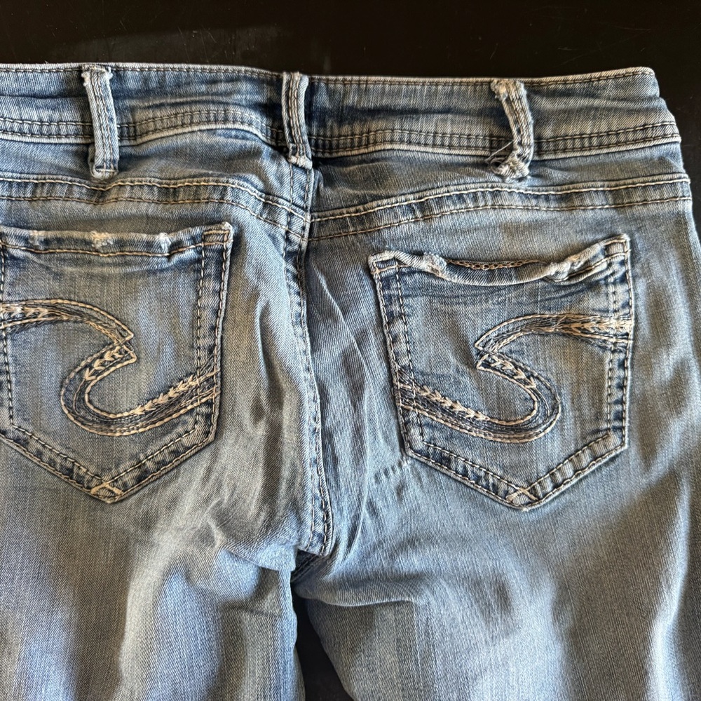 Silver Jeans Blue Distressed Denim with S-Stitching